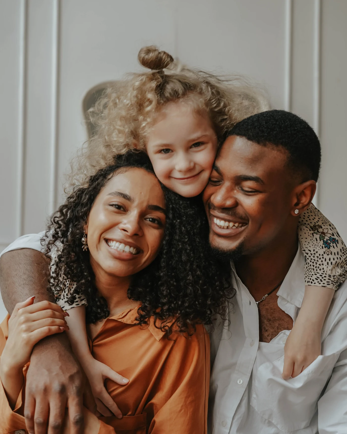Smiling parents and their daughter, patients at Lambton Dental